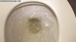 Tight girl pooping over toilet