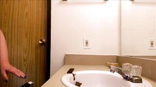 Beautiful blonde shitting in a white sink