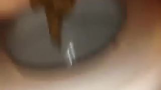 Fingering her tight ass while she's pooping