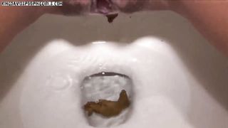 Brunette babe pooping