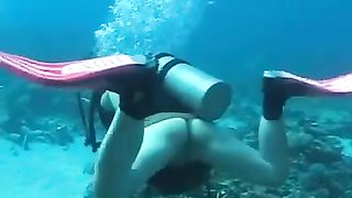 Two Japanese girls poop underwater