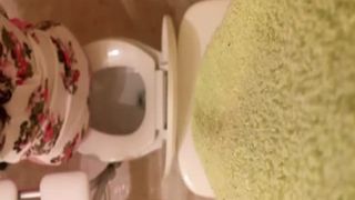Spying on a brunette girl shitting
