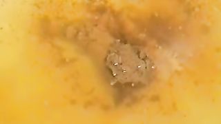 Shaking her ass while shitting