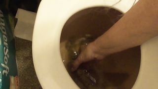 Playing with her big turds