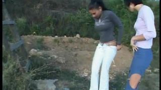 Two girls poop by turn outdoor