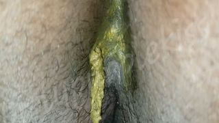 Ebony girl shitting in close up