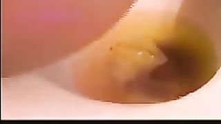 Black girl shits over toilet