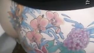 Giant turd from tattooed ass