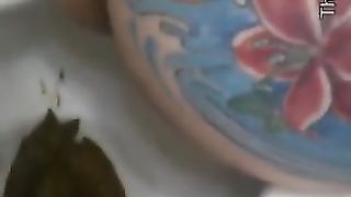 Giant turd from tattooed ass