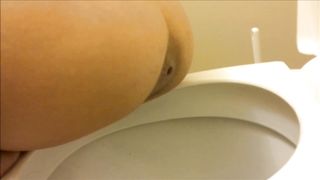 Nice brunette shits over toilet