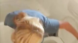 Blonde babe shits over toilet