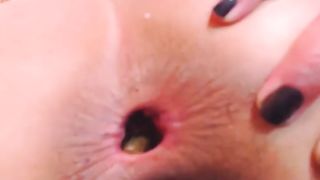 Dark haired babe pushing big turd