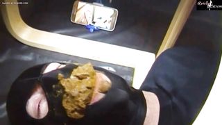 Masked slave forced to eat poop