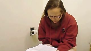 reading an article on the toilet and wiping her ass