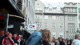 drunk woman pisses in public on a chair