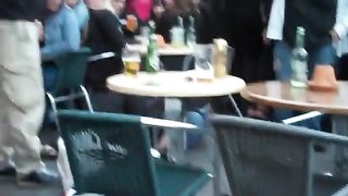 drunk woman pisses in public on a chair