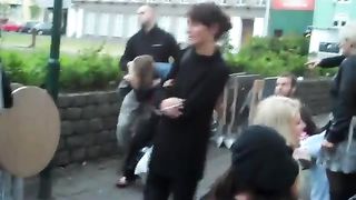 drunk woman pisses in public on a chair