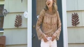 shiting in her white pants infront of her house