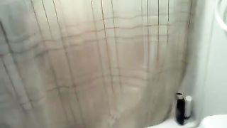 girlfriend taking a piss over her friend taking a shower
