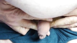 Chub pissing through foreskin of his tiny soft cock