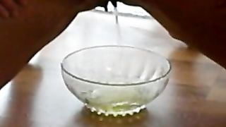 girl pissing in a little bowl with power