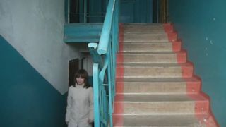 Cute girl peeing on the stairs