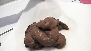 Woman with pierced vagina pooping