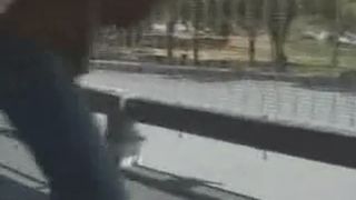 Young girl pooping on the car park