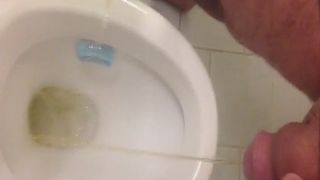 Dude Peeing on the toilet