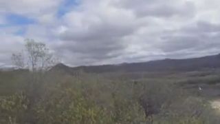 Sexy babe peeing on the rocks