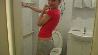 Blonde peeing in the toilet