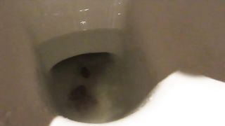 Woman shitting in the toilet