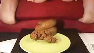 Babe pooping on a yellow plate