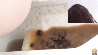 Dark haired beauty shitting