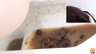 Dark haired beauty shitting