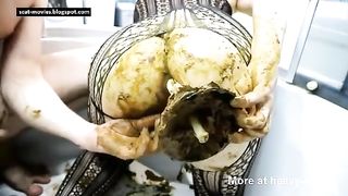 Smearing green shit on girlfriend's ass