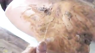 Smearing shit on entire body