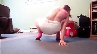 Redhead babe shits in white diapers