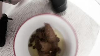 A bowl filled with pee and shit
