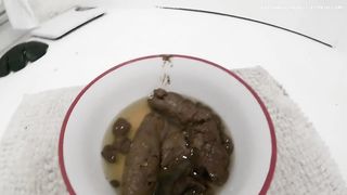 A bowl filled with pee and shit