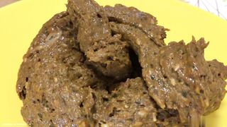 Nerdy babe shitting on yellow plate