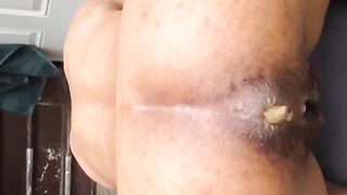 Ebony babe shits in a parking lot