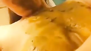 Rubbing poop on entire face