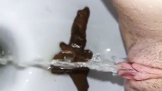 Close up of sexy babe shitting