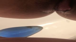 Hairy babe using butt plug