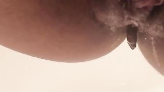 Hairy babe using butt plug