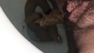 Hairy babe shits in toilet