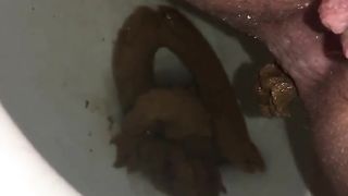 Hairy babe shits in toilet