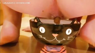 Hairy babe shitting in a glass bowl