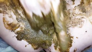 Using a dildo to penetrate her dirty pussy